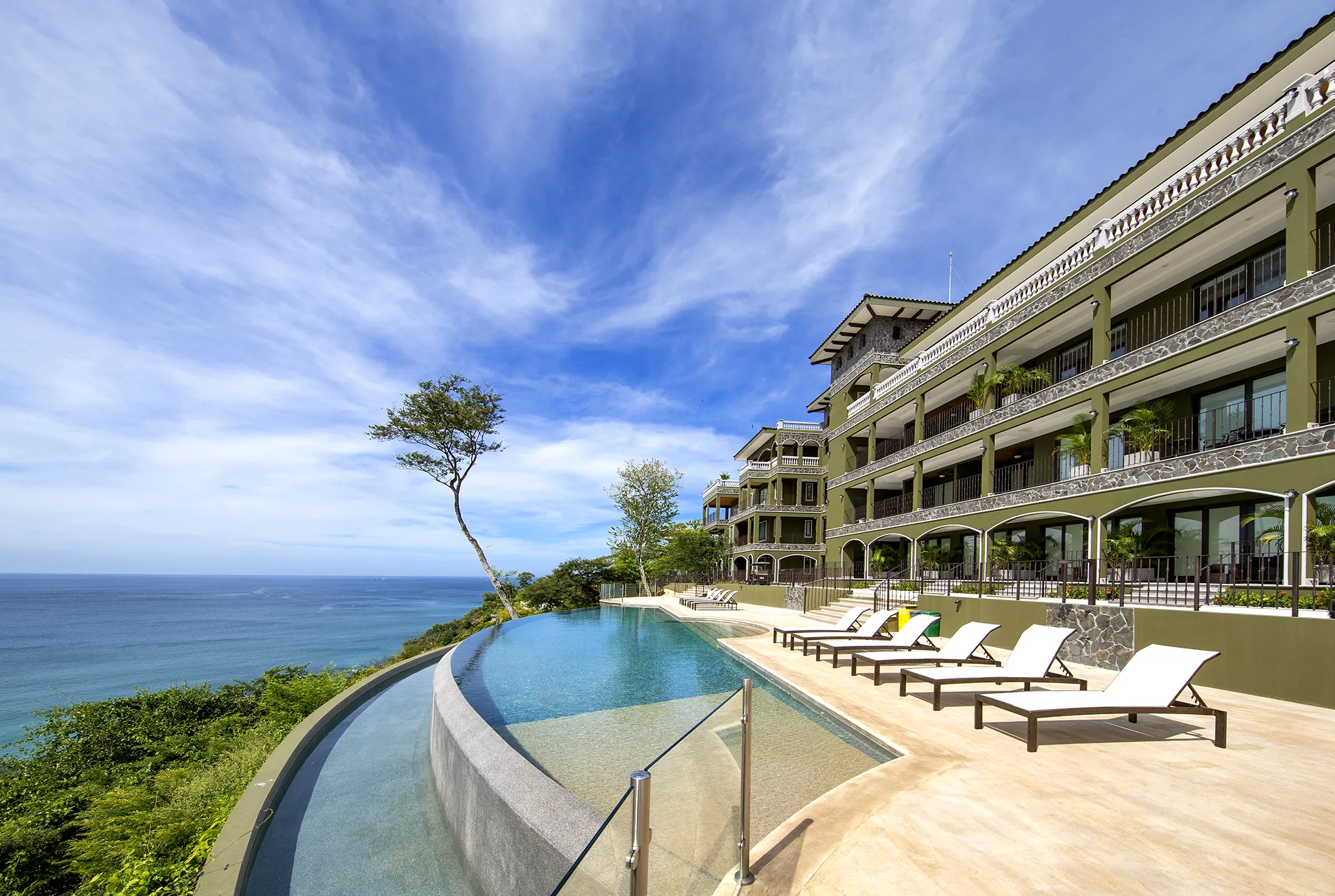360 Splendor's hillside residences and infinity pool overlooking Playa Flamingo.