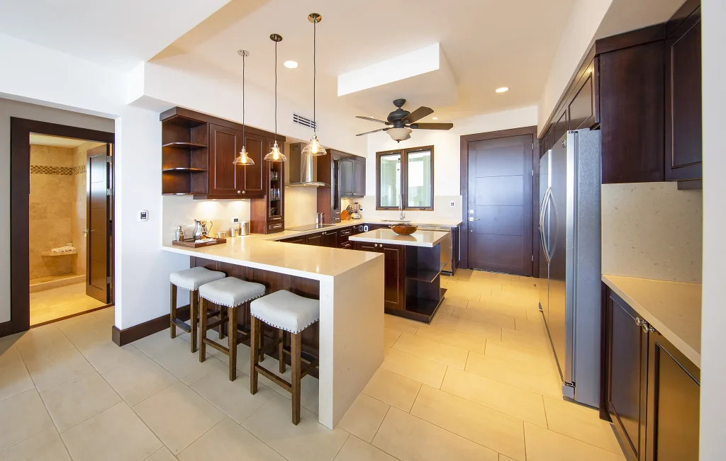 Fully equipped kitchen at 360 Splendor with island seating and stainless appliances.