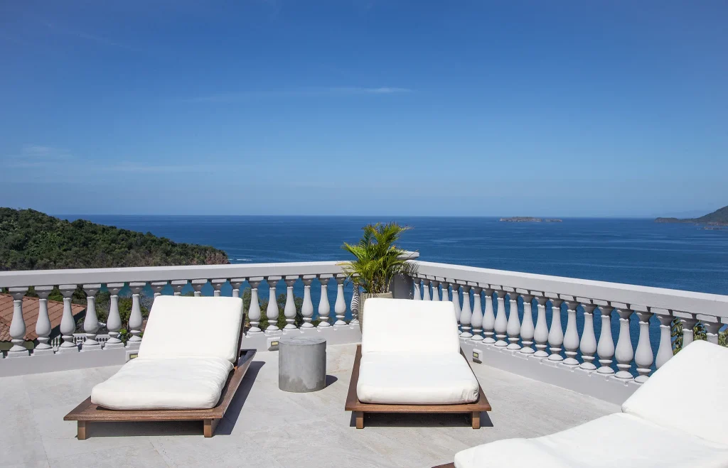 Sun loungers on the terrace at 360 Splendor overlooking the Pacific.